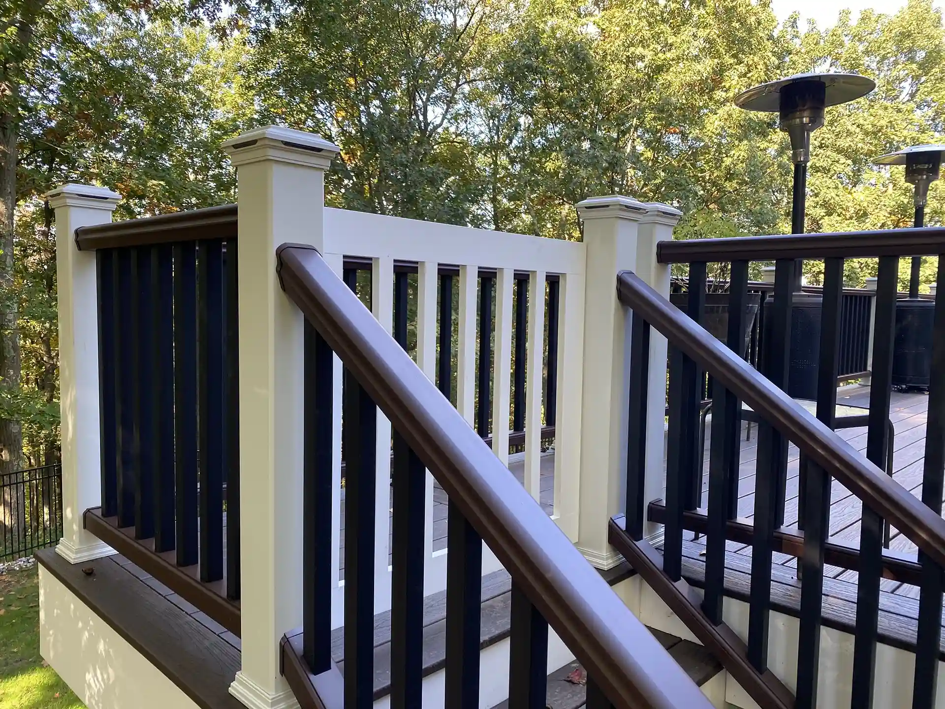 photo of a custom deck with deck railing and a security gate