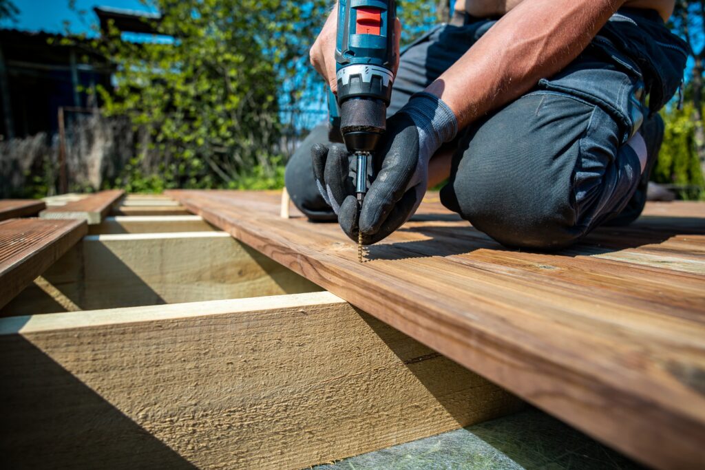 A contractor building a deck for a customer