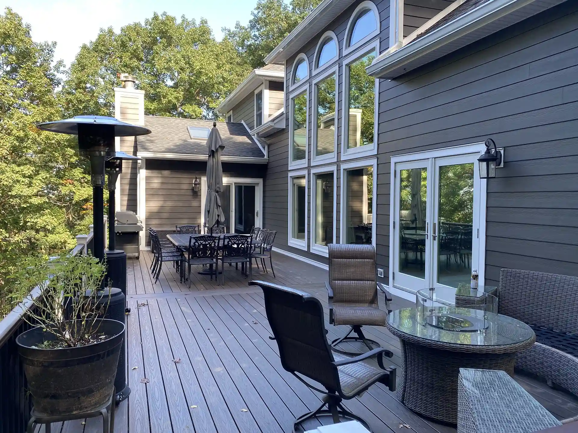 photo of a composite deck with outdoor furniture and potted plants