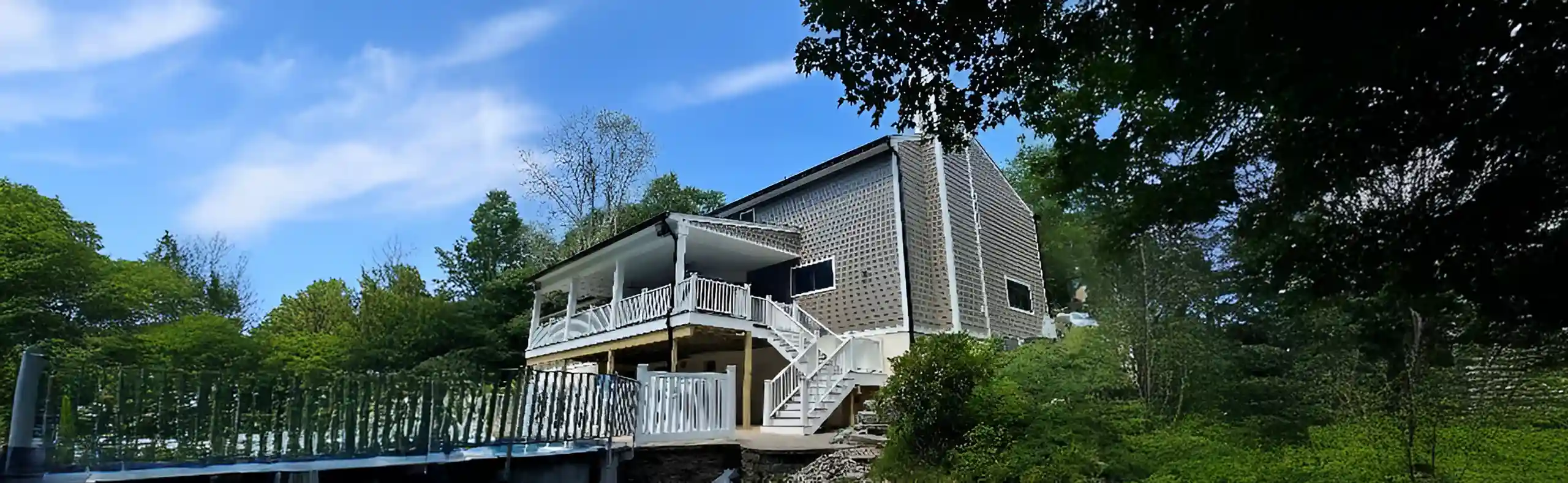 photo of multi-level deck with a pool deck, deck railing and deck steps by a deck builder in Morristown NJ