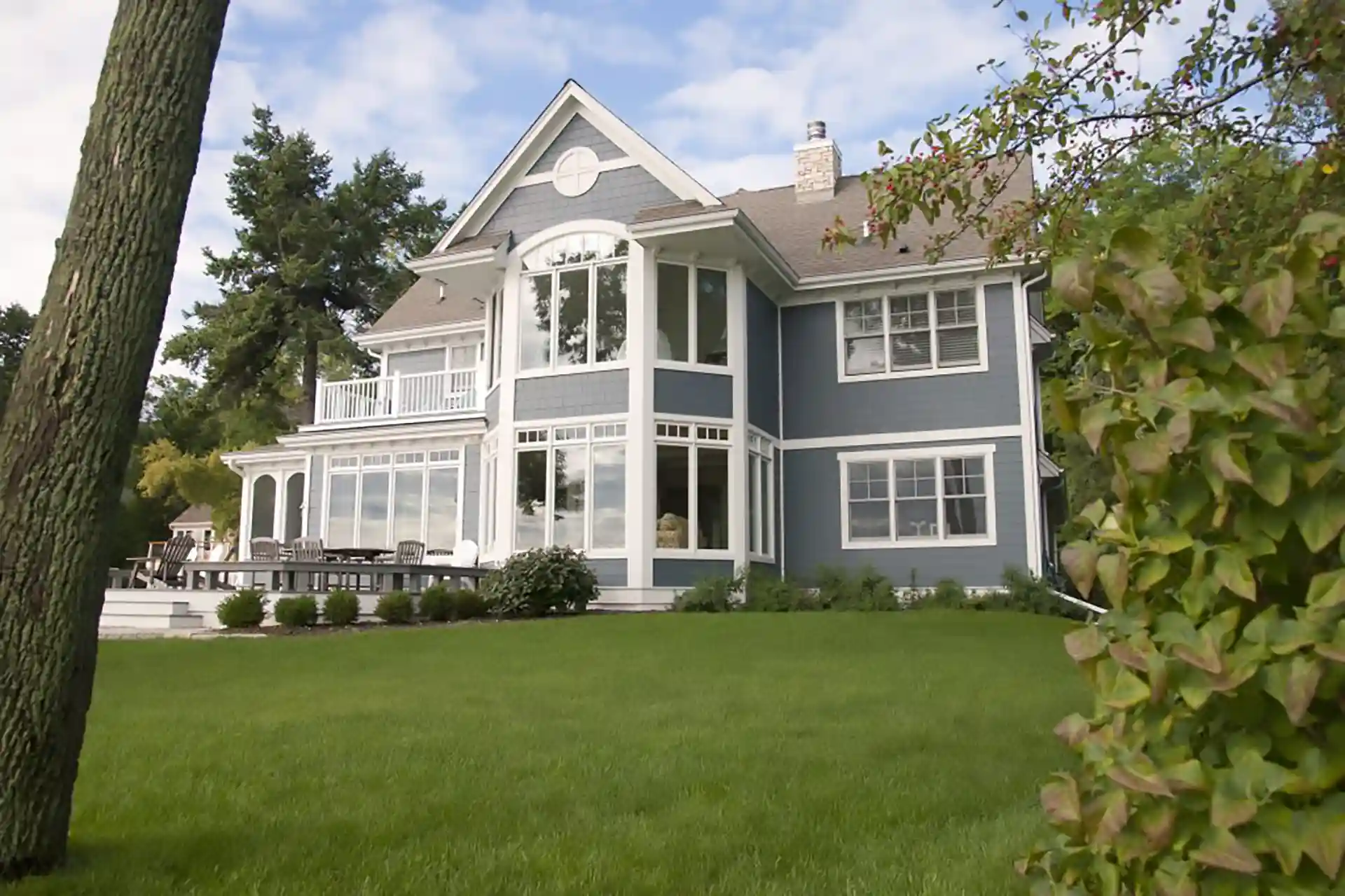 photo of a home with many tall windows
