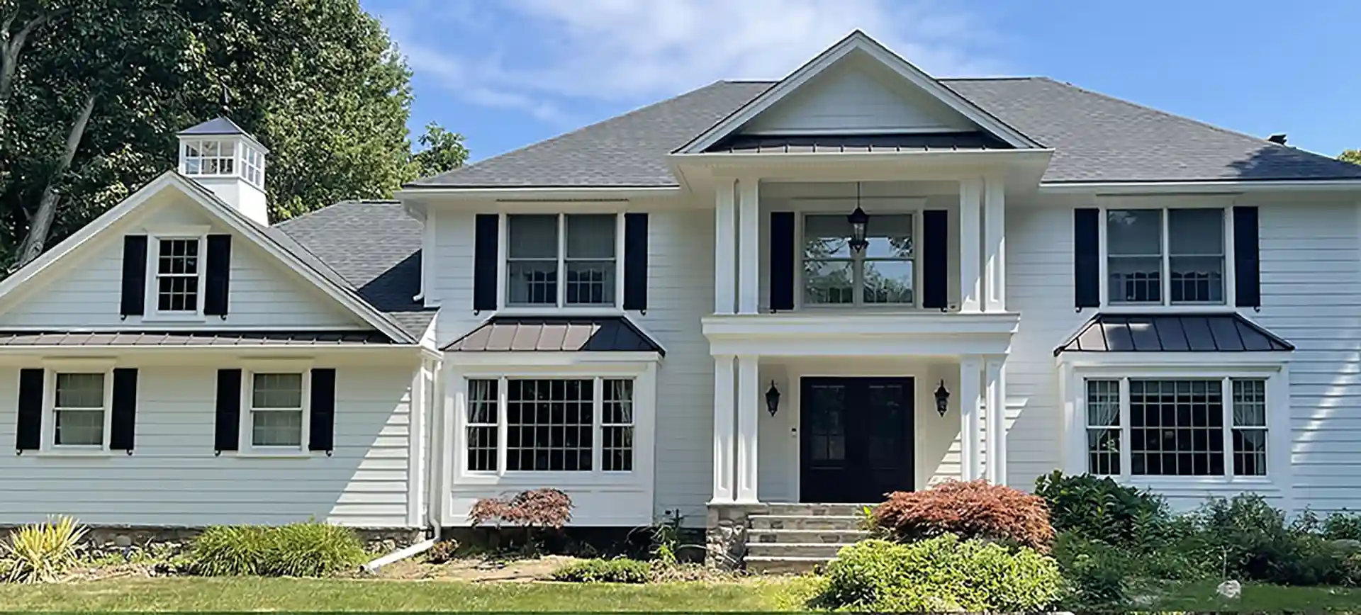 photo of a home with a two-story portico 